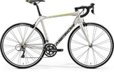 Merida Scultura Rim 100 road bike with Shimano Claris R2000 groupset, lightweight frame, and durable design for performance riding.