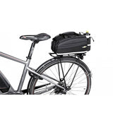 Topeak MTS TrunkBag EX 8L black bike rack bag with weather-resistant fabric and Velcro mounting system for cycling accessories.