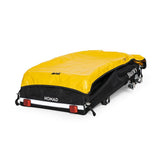 Burley Nomad cargo bike trailer with water-resistant cover, foldable design, featuring sturdy frame and spacious storage area.