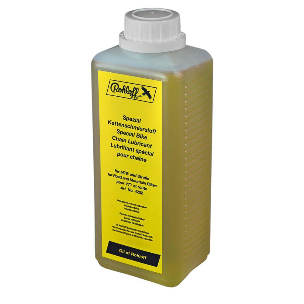 Rohloff synthetic biodegradable chain lube for Lubmatic system, workshop-grade lubricant applied to bike chain in a workshop setting