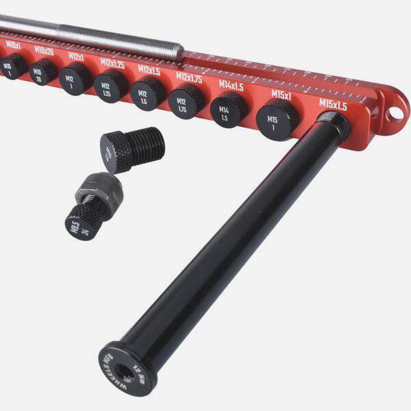 Wheels Manufacturing Axle Ruler Pro for precise bike axle and thread measurement, featuring a durable plastic tool with measurement markings.