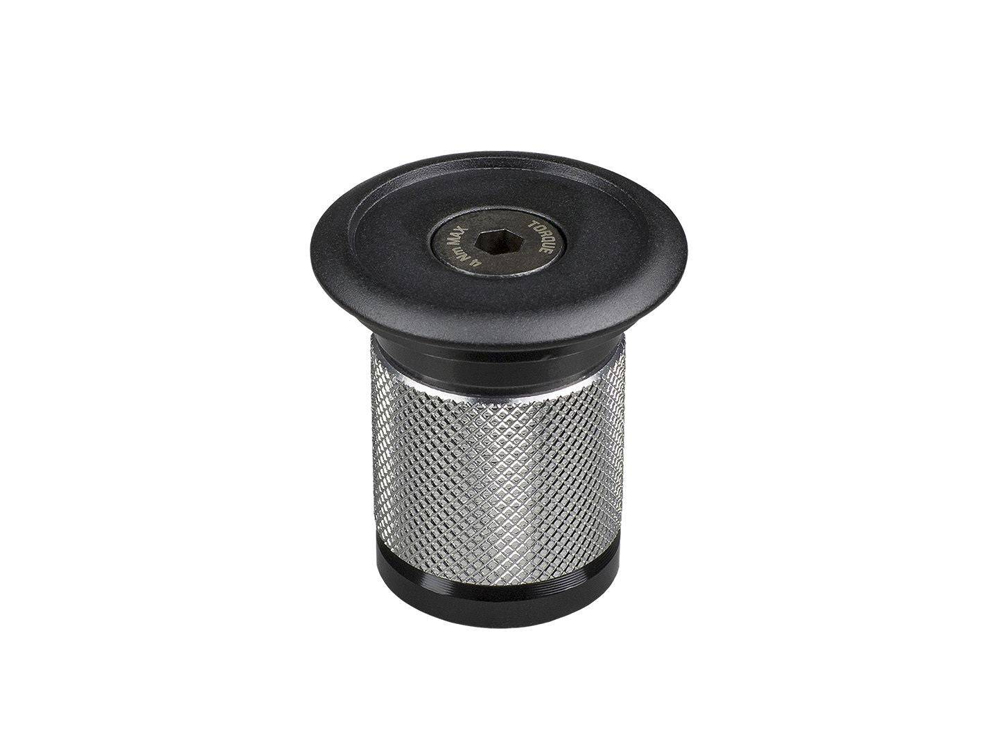 Black Bontrager headset expander plug and top cap for 1-1/8 inch carbon fiber steer tubes on Trek bikes.