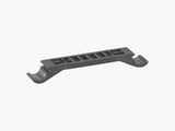Trek Marlin+ motor armor spacer replacement for frame protection, shown as a small component part for bike maintenance.