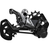 Shimano XTR RD-M9100 12-speed MTB rear derailleur with Shadow Plus design, black component with metal accents.