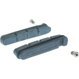 Shimano R55C3 carbon rim brake pads for Dura-Ace road brake systems, showing close-up of brake pad design and mounting hardware.