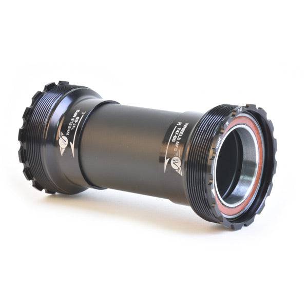 Wheels Manufacturing T47 inboard angular contact bearings for 30mm cranksets, shown with metallic finish and precision design.