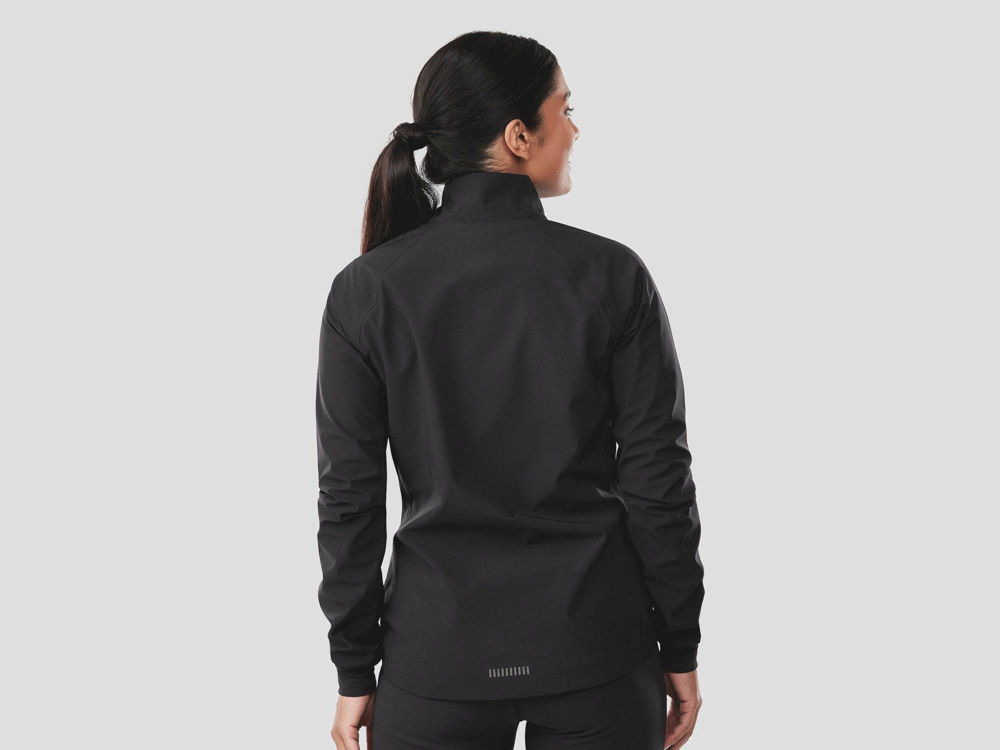 Trek Circuit Women's waterproof rain cycling jacket in lightweight, packable design, shown in a vibrant color.