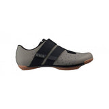 Fizik X4 Terra MTB shoes for gravel and mixed-terrain cycling, showing a close-up of the black shoes with textured soles.