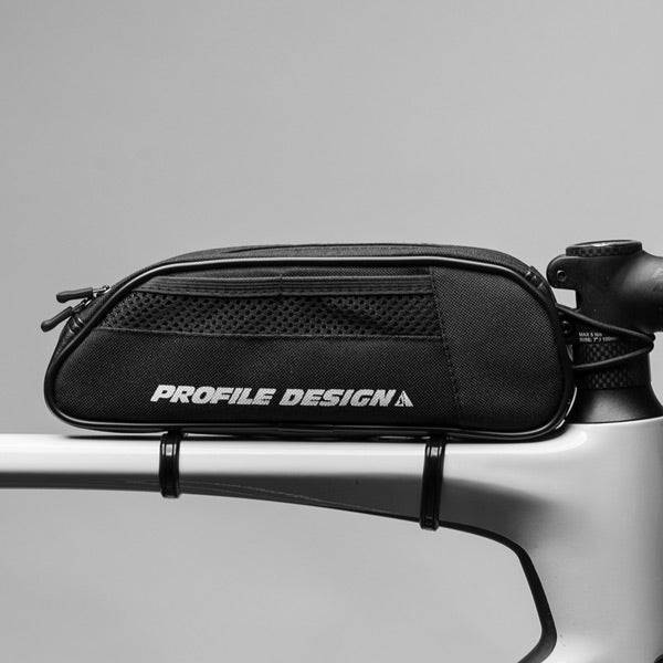 Profile Design Explorer large top tube bike storage pack with splash-proof zipper, mounted on bicycle top tube for easy access.