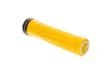 Ergon GA2 ergonomic mountain bike grips with CNC aluminum clamps and replaceable plugs, shown on a bike handlebar.