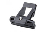 Topeak Fixer F25 black bike saddle accessory mount attached to a bike saddle for secure, lightweight gear storage.