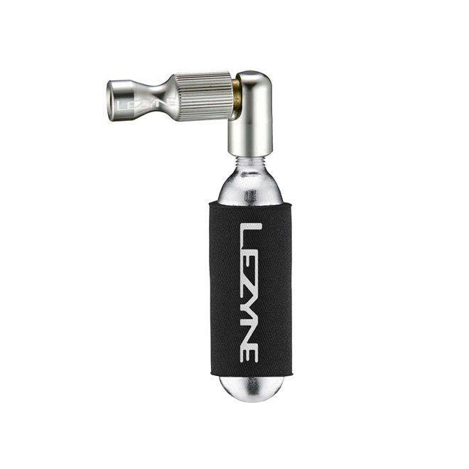 Lezyne Trigger Drive CO2 inflator pump with twin chuck for Presta and Schrader valves, shown with inflator and valve adapters.