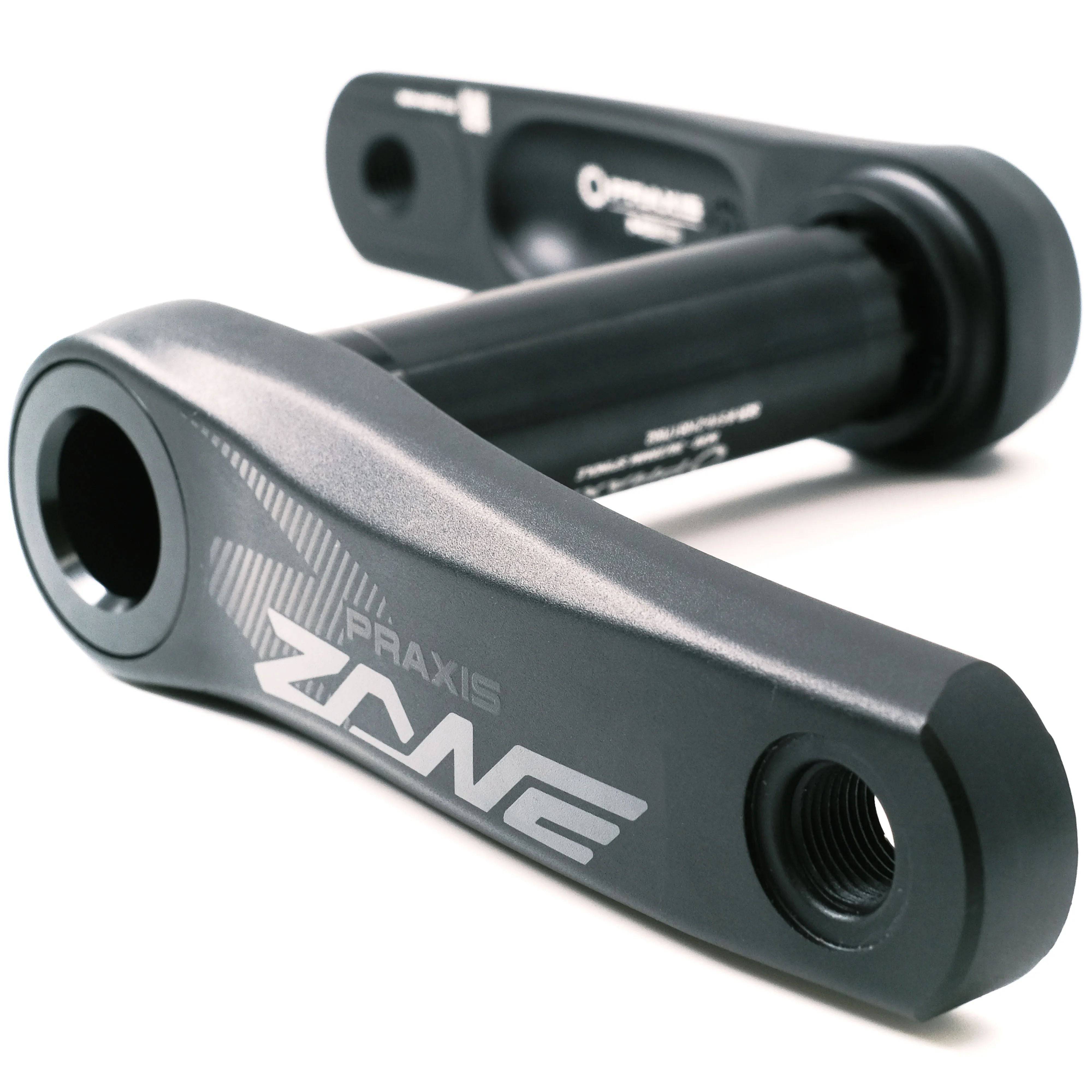 Praxis Works Zane Youth DM M30 Cranks for mountain biking, showing black short crank arms with branding, suitable for kids' MTB bikes.