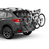 Thule OutWay rear-mount 2 bike carrier rack with anti-sway and locking cable, showing mounted bikes and secure locking features