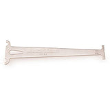 Park Tool CC-3.2 chain wear indicator gauge measuring 10-speed bike chains in a workshop setting.