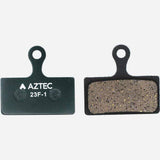 Aztec disc brake pads for Shimano XTR M985, XT M785, and SLX M675 e-bike models, shown with mounting hardware.