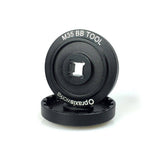 Praxis Works M35 Bottom Bracket Tool 2-Pack with 3/8" socket for Fuji bikes, shown in a workshop setting.