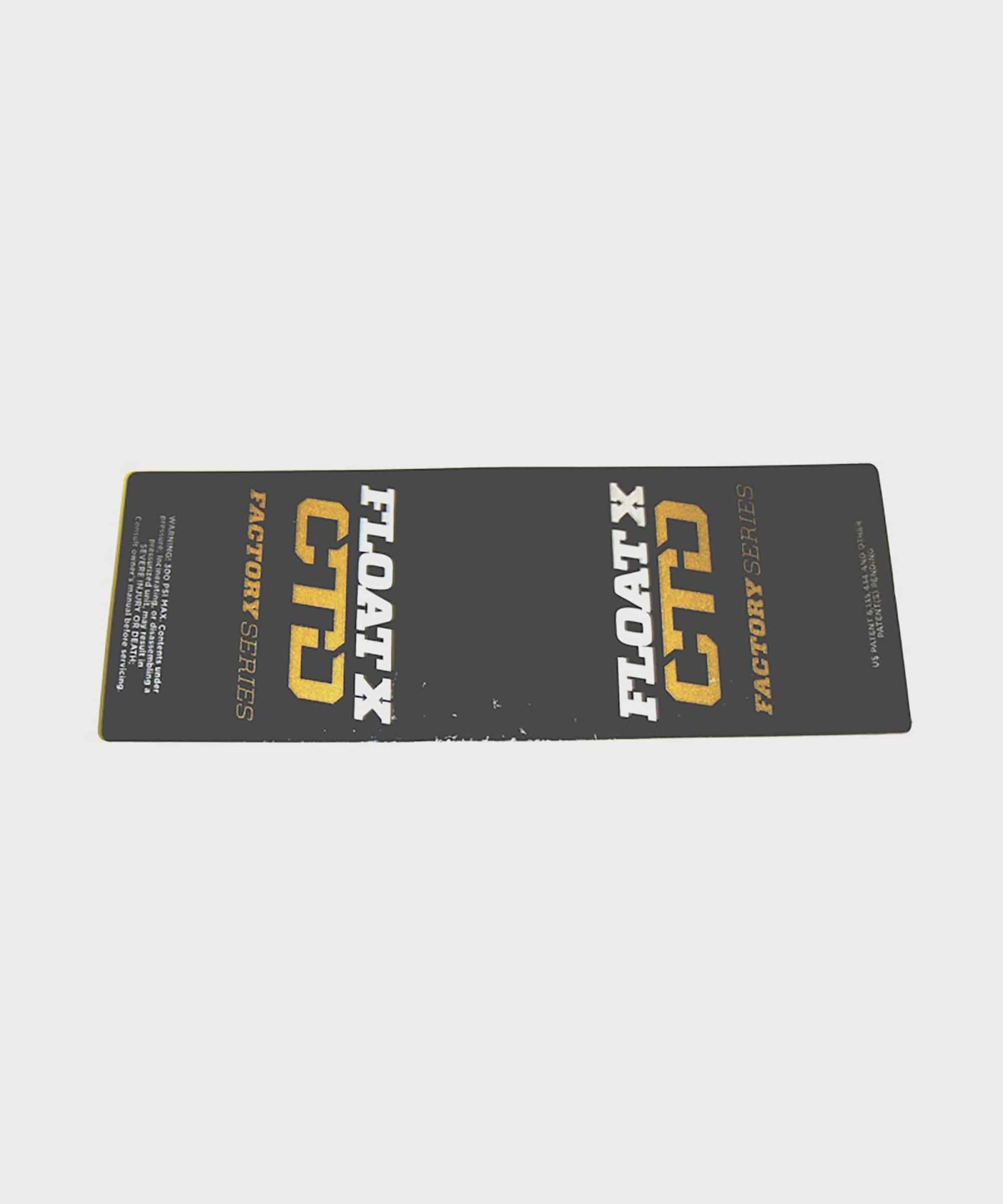 Fox Shock FLOAT X CTD LV 2014 gold decal replacement sticker on rear shock component, featuring bright gold design and branding.