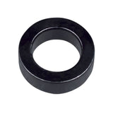 Black Trek shock assembly spacer, 5mm x 10mm, for full-suspension bike frames, showcasing the component's compact size and design.
