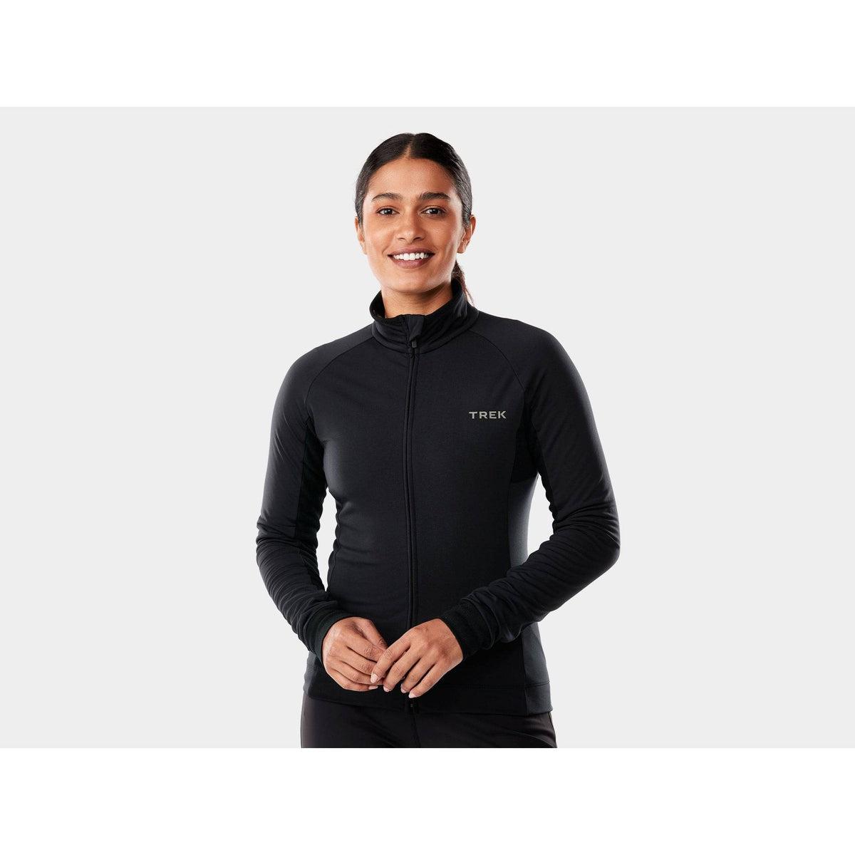Trek thermal cycling knee warmers, insulated and ergonomic unisex clothing for cold weather, shown on a cyclist.