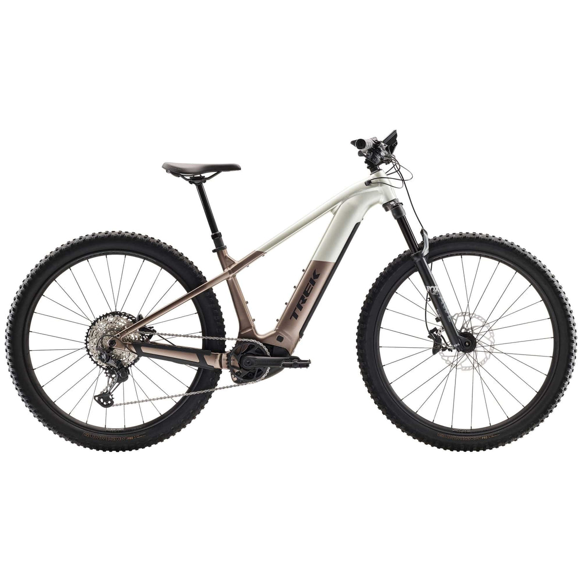 Trek Powerfly+ 8 electric mountain bike with Gen 5 motor and Shimano Deore XT drivetrain, shown on rugged trail.