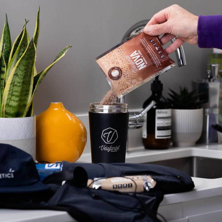 Veloforte vegan and whey protein shake bottles, low-calorie supplement for gut health and recovery, displayed as accessories.