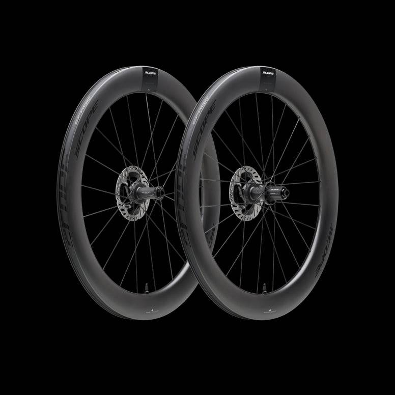 Scope Cycling R6.A V2 65mm allroad wheelset with tubeless-ready, aerodynamic design, featuring sleek black rims and spokes.