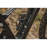 Topeak Cage Mount Side accessory for bottle cage accessories on e-bikes and mountain bikes, shown mounted on bike frame.