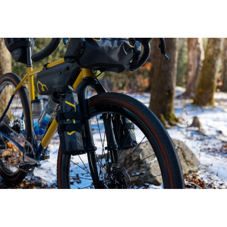 Cane Creek Invert Cargo Mount for bikepacking forks with 3-bolt interface, shown attached to bike fork with mounting hardware