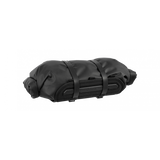 Topeak Rackloader 12L weatherproof bike rack bag with straps, shown attached to a bicycle rack for secure storage.