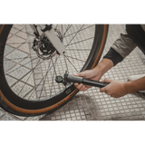 Topeak Shuttle Gauge Digital 2.0 bike tire pressure gauge showing pressure reading, compatible with Presta and Schrader valves.