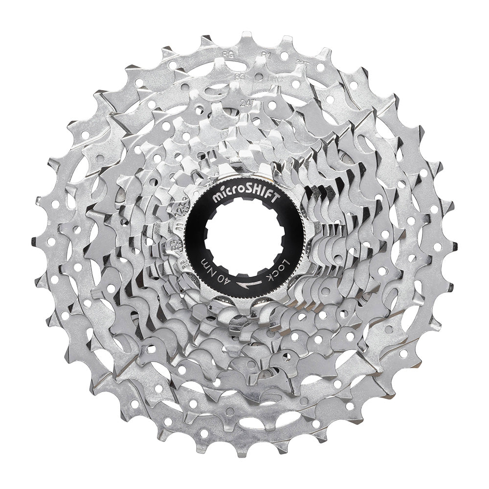 MicroSHIFT G-Series 11-speed road bike cassette with aluminum spider carrier, featuring metal sprockets and precise gear teeth.