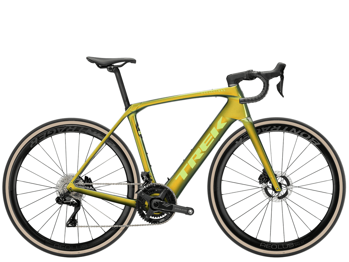Trek Domane+ SLR 9 electric road bike with TQ harmonic pin ring motor and extended range, shown from the side.