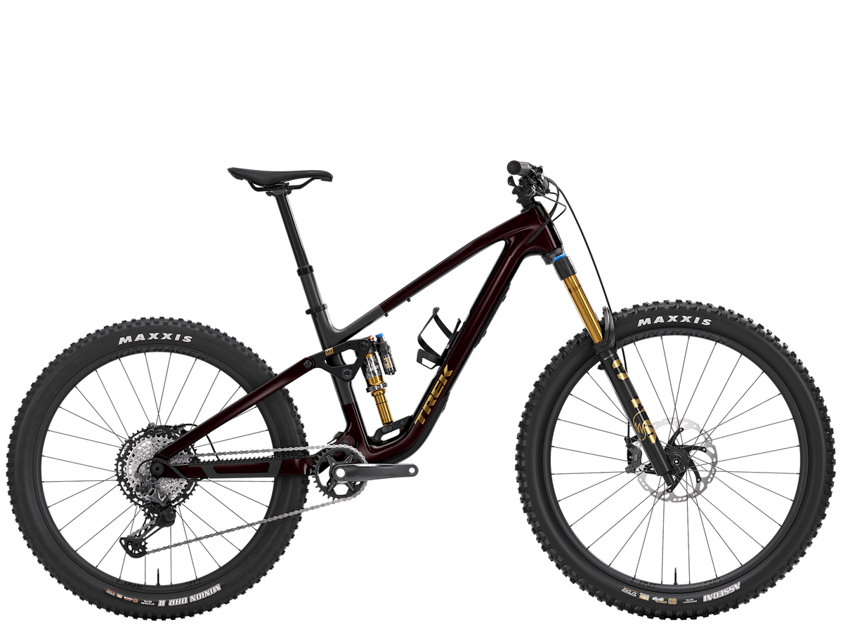Trek Fuel MX 9.8 XT Gen 7 mountain bike with adjustable suspension and 26-inch wheels for versatile trail riding.