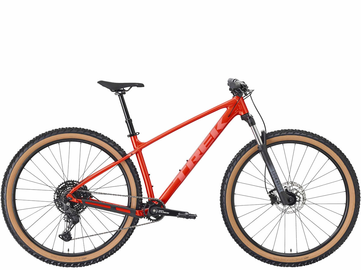 Trek Marlin 6 Gen 3 mountain bike with black frame, front suspension, and knobby tires for trail and urban cycling.