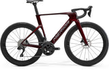 Red and gray Merida Reacto 6000 road bike with Shimano 105 Di2 and 60mm carbon rims, sleek aerodynamic design.