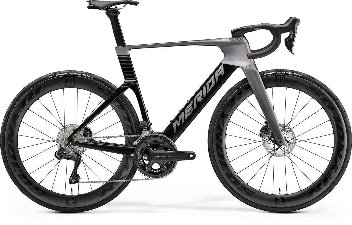 Merida Reacto 8000 road bike with Shimano Ultegra Di2 electronic groupset and Reynolds AR 60 carbon wheels, gray and black design.