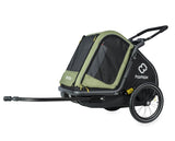 Green Hamax Pluto Medium Dog Trailer 2023 with bike trailer and stroller kit, showcasing the durable, enclosed dog transportation accessory.