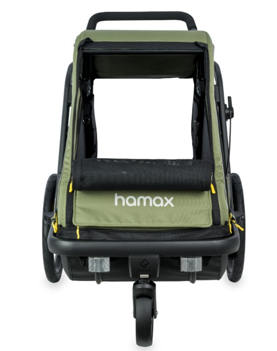 Green Hamax Pluto medium dog trailer for bikes and strollers, featuring durable fabric and safety features for pet transportation.