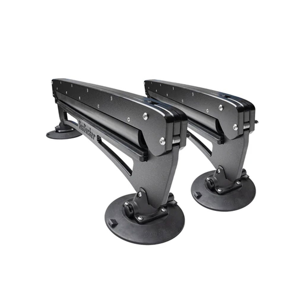 SeaSucker Classic Ski Rack vacuum mount holding four pairs of skis and snowboards for car roof storage.
