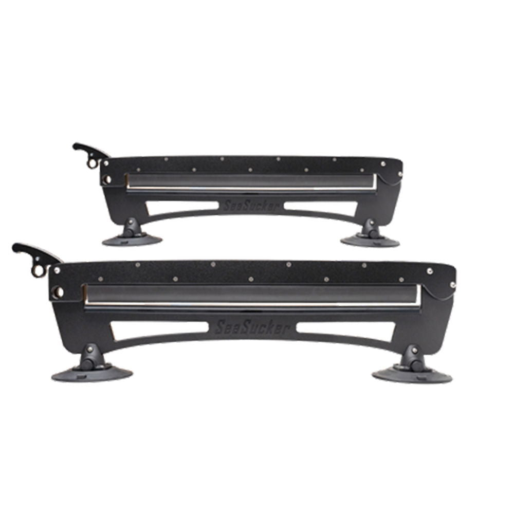 SeaSucker Classic Ski Rack vacuum mount holding four pairs of skis and snowboards for roof storage accessories.