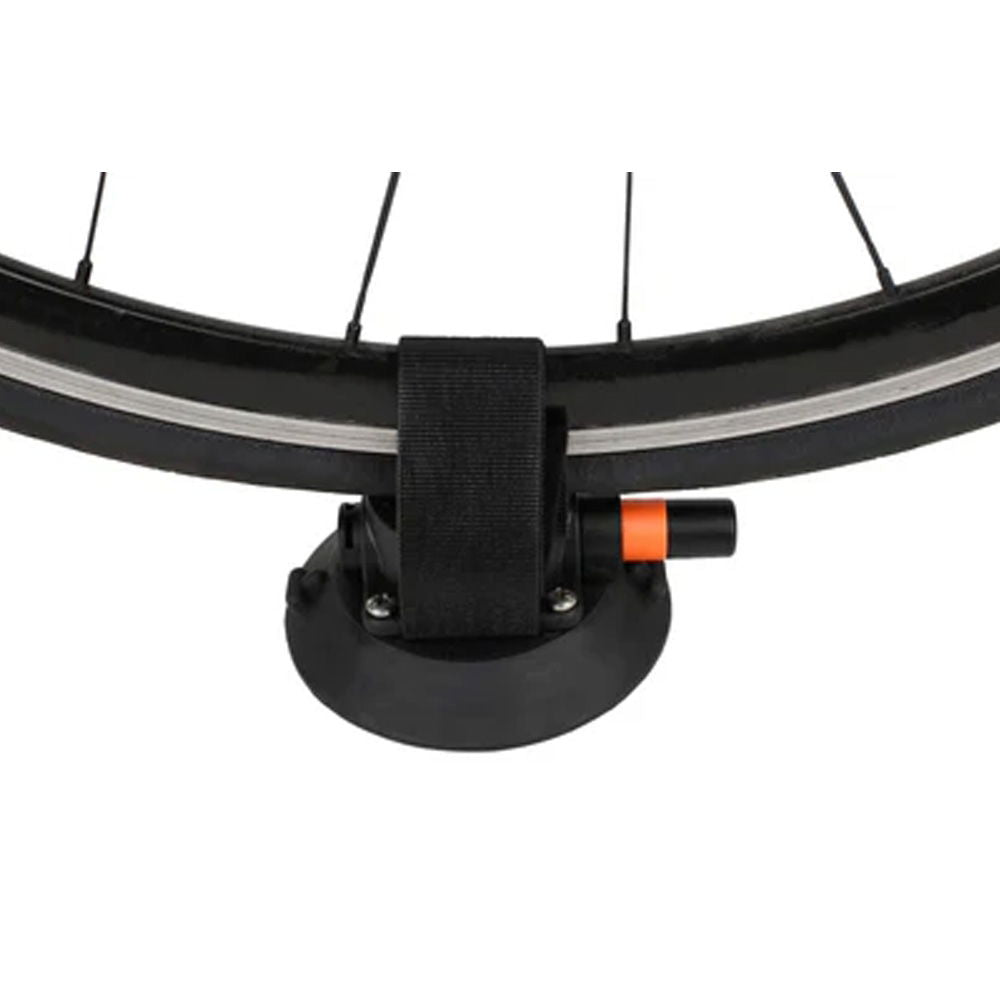 SeaSucker Compact Rear Wheel Strap securing a bike wheel on a roof-mounted bike rack for added stability and safety.