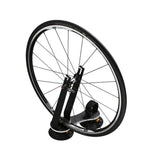 SeaSucker Flight Deck bike rack accessory with front wheel mounting and stability features, shown with mounted wheel on a black platform.