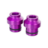 Pair of purple SeaSucker 12x110mm HUSKE fork mount plugs for bike transport accessories, designed for quick and secure bike mounting.