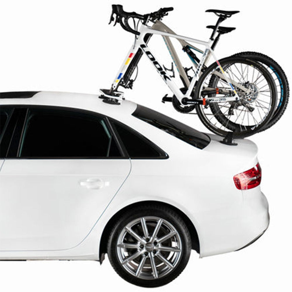 SeaSucker Mini Bomber 2-bike rack for e-bikes, fork-mount vacuum rack installed on car roof for secure transport.