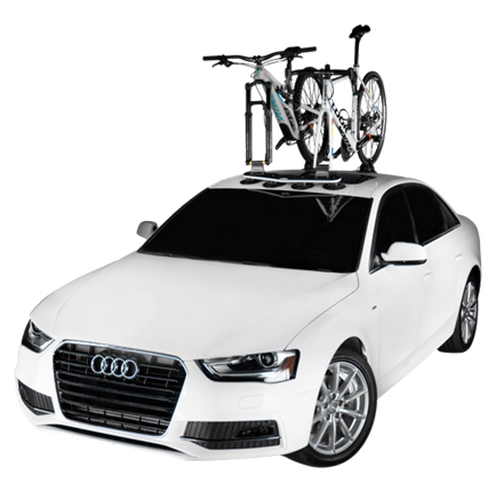 SeaSucker Mini Bomber 2-bike fork-mount vacuum rack attached to a car roof for e-bikes, showcasing durable bike transport accessories.