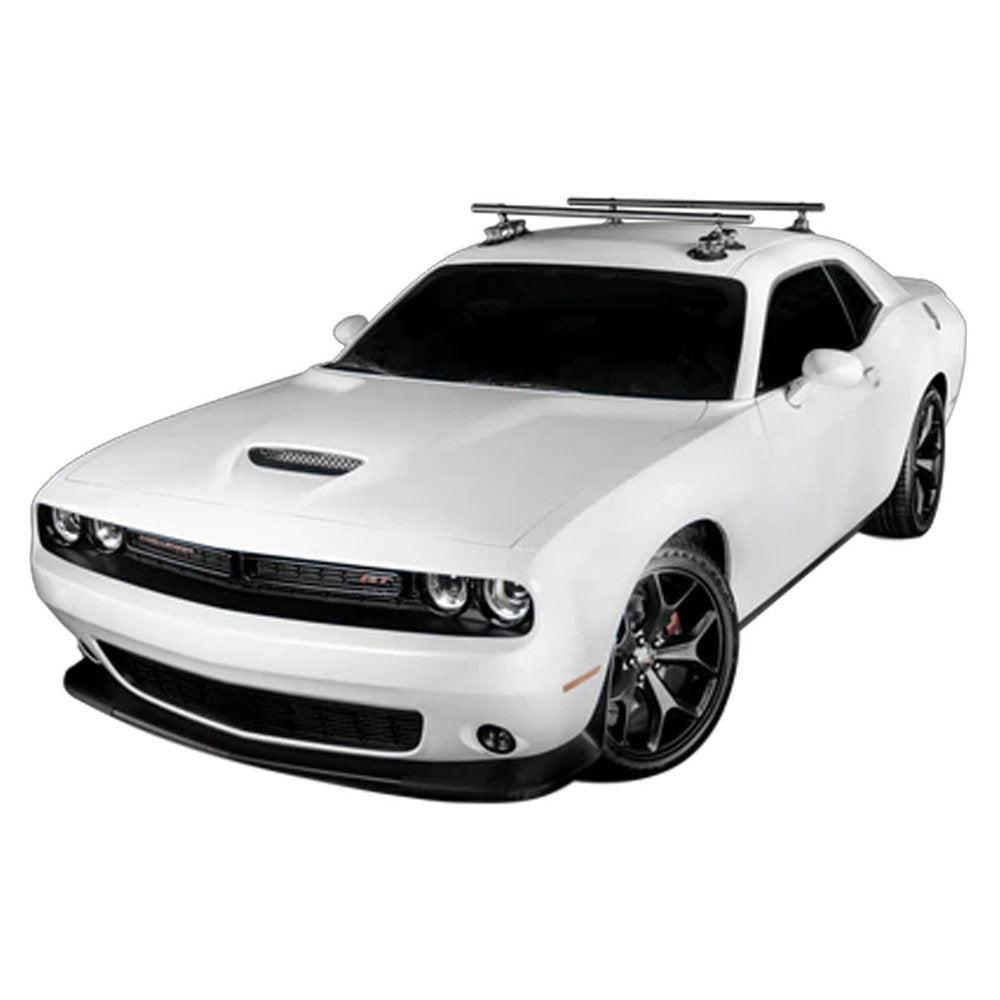 SeaSucker Monkey Bars 60-inch roof cross-bar system for outdoor gear transport, installed on vehicle roof with gear attachments.