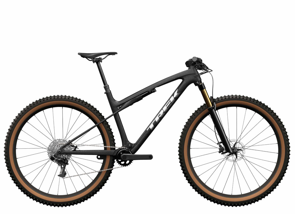 Trek Supercaliber SL 9.6 Gen 2 mountain bike with IsoStrut suspension, featuring a lightweight frame and knobby tires for off-road riding.