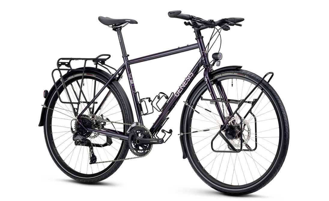 Genesis Tour de Fer 30 2026 touring bike with Shimano 2x10-speed drivetrain and integrated dynamo lighting, shown in the image.