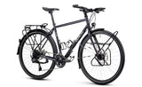 Genesis Tour de Fer 30 2026 touring bike with Shimano 2x10-speed drivetrain and integrated dynamo lighting, shown in the image.
